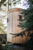 Tin house with exterior wooden cladding