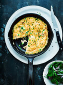 Smoked trout and pea frittata with parsley and red onion salad