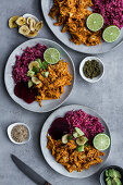 Spicy chicken curry with banana chips and red beet quinoa
