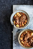 Pork cheeks with perry and white beans