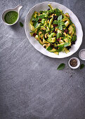 Black bean, avo and dried cranberry salad with coriander, parsley and parmesan dressing