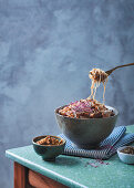 Buckwheat noodles with walnut pesto, chilli mushrooms and amaranth