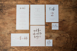 Various wedding cards on wooden surface