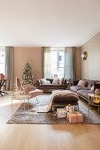 Elegant living room decorated in pink, gold and mauve at Christmas