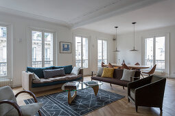Mid-century modern furniture in living room of French period building