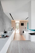 Sideboard in sunken, open-plan kitchen in architect-designed house
