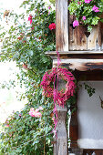 Purple wreath of rose hips, amaranth and ribbons