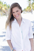 A long-haired woman wearing white shirt