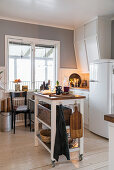 White cabinets and island counter in kitchen