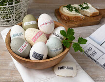 Eggs decorated with magazine clippings in various natural shades