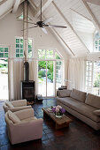 Terracotta tiled floor in living room in modern country-house style