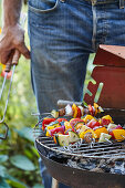 Vegan vegetable kebabs on a barbecue