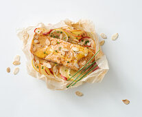 Salmon steak with honey, apple and lemon in parchment paper