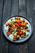 Roasted pumpkin and Brussels sprouts with chestnuts and herb yogurt