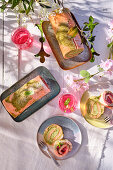 Strawberry and pistachio roulade on a sunny garden table