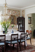 Set dining table and dark chairs in classic dining room