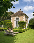 Old stone house in summery, English-style garden