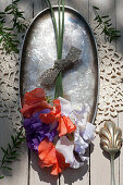 Bouquet of sweet peas on silver dish