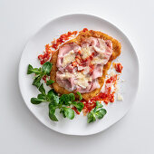 Cotoletta alla bolognese (breaded schnitzel with raw ham and parmesan, Italy)