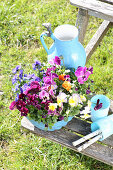Violas and pansies planted in blue bundt cake tin