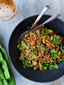 Asian noodles with vegetables and edamame