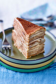 A piece of tiramisu pancake cake