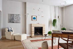 Desk and open fireplace in classic living room