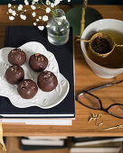 Energy balls with chocolate icing served with tea