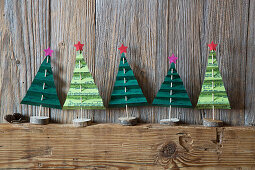 Festive arrangement of handmade paper Christmas trees