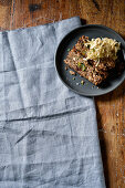 Herby nut roast with a pistachio crust and sauerkraut