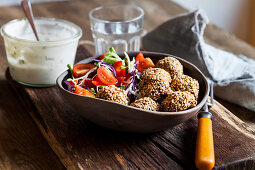 Salad with baked spinach falafel