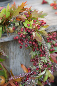 Wreath of hawthorn berries, ling and leafy branches