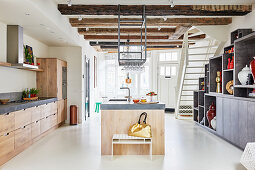 Custom kitchen with island counter in open-plan interior