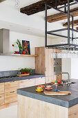 Open-plan kitchen with wooden cabinets and island counter