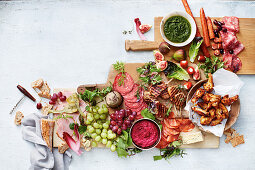 Brunch plates with sausage, poultry and dips