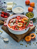 Preparation of apricot and strawberries crumble