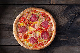 Pizza with salami, chorizo and ham