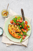 Salmon cutlet with spinach salad