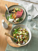 Mediterranean pasta salad and roast beef with roasted vegetables