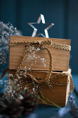 Christmas arrangement of wooden drawers with golden ribbons