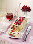 Cold dog with white chocolate and berries