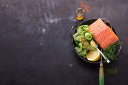 Ingredients for a salmon dish with cucumber