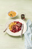 Fillet steak with cherry-red wine sauce and spaetzle