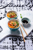 Oriental wheat noodles with fried vegetable strips
