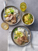 Creole chicken schnitzel with rice and celery and pineapple salad