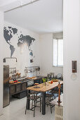 View into kitchen with industrial-style dining table