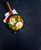 Chorizo and kale hash with fried eggs