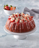 Strawberry cake with whipped cream and icing