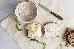 Slices of wholemeal bread with a cream cheese spread and sliced cheese