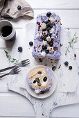 Vegan blueberry Swiss roll with chocolate and almonds